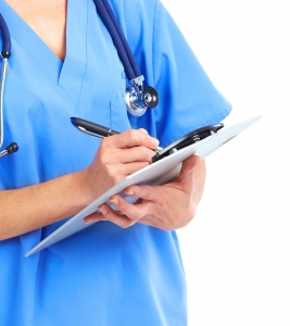 doctor taking notes on a clipboard